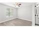 Bedroom showcasing a window with blinds and the bathroom entrance to the right at 1932 Lake Atriums Cir # 69, Orlando, FL 32839