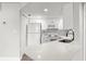 Bright kitchen featuring white cabinetry, quartz countertops, and stainless steel appliances at 1932 Lake Atriums Cir # 69, Orlando, FL 32839