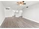 Bright living room with a modern kitchen, and stainless steel appliances at 1932 Lake Atriums Cir # 69, Orlando, FL 32839