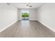 Spacious living room with sliding glass doors leading to a balcony, offering natural light at 1932 Lake Atriums Cir # 69, Orlando, FL 32839