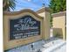 The Plaza at Millenium luxury condominiums sign with landscaping, address and building details at 1932 Lake Atriums Cir # 69, Orlando, FL 32839