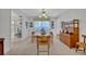 Elegant dining room with a classic chandelier, ample seating, and built-in shelving at 2040 Mohawk Trl, Maitland, FL 32751