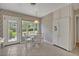 Bright eat-in kitchen features tile flooring, white appliances and cabinets and a view to the outdoors at 2040 Mohawk Trl, Maitland, FL 32751