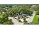 Overhead shot of the property highlighting the surrounding mature trees and neighborhood at 205 S Highland Ave, Apopka, FL 32703