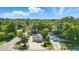 Aerial view showcases the property's landscaped yard, and proximity to lush greenery at 205 S Highland Ave, Apopka, FL 32703