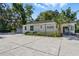 Commercial property exterior with signage, attractive landscaping, and ample parking at 205 S Highland Ave, Apopka, FL 32703