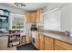 Functional kitchenette with wood cabinets, a sink, countertop space, and natural light at 205 S Highland Ave, Apopka, FL 32703