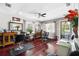 Salon featuring salon chairs, hardwood floors, and an exit to the front porch at 205 S Highland Ave, Apopka, FL 32703