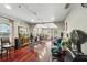 Spacious salon with hardwood floors, salon chairs, waiting area, and ample natural light at 205 S Highland Ave, Apopka, FL 32703