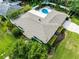 Aerial view of a well-maintained home with a backyard swimming pool, lush landscaping, and a private outdoor space at 2109 Montana St, Orlando, FL 32803