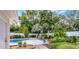 Serene backyard oasis featuring a sparkling pool, patio area, and lush tropical landscaping for relaxation and entertainment at 2109 Montana St, Orlando, FL 32803