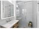 A renovated bathroom features a glass shower and modern vanity at 2109 Montana St, Orlando, FL 32803