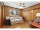 Cozy bedroom featuring paneled walls and a ceiling fan at 2109 Montana St, Orlando, FL 32803