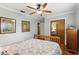 A comfortable bedroom with wood floors features a ceiling fan and closet at 2109 Montana St, Orlando, FL 32803