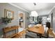 Elegant dining room featuring hardwood floors and an adjacent view to the living room at 2109 Montana St, Orlando, FL 32803