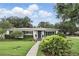Charming single-story home featuring a well-manicured lawn and beautiful landscaping at 2109 Montana St, Orlando, FL 32803