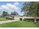 Inviting home exterior featuring a manicured lawn and mature landscaping at 2109 Montana St, Orlando, FL 32803