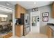 Well-lit kitchen with stainless steel refrigerator and views into the dining and living rooms at 2109 Montana St, Orlando, FL 32803