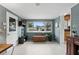 Bright and airy sunroom with a large window and neutral tiled floor at 2109 Montana St, Orlando, FL 32803