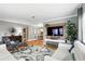 Open-concept living room showcasing hardwood floors and access to the dining area at 2109 Montana St, Orlando, FL 32803