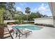 Backyard oasis with a refreshing pool, lounge chairs, and lush landscaping at 2109 Montana St, Orlando, FL 32803