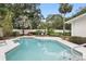 Sparkling pool with surrounding patio and lush landscaping provides a private retreat at 2109 Montana St, Orlando, FL 32803