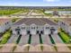 Aerial view of new townhomes with driveways and green spaces at 2224 Tay Wes Dr, St Cloud, FL 34771