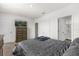 Cozy bedroom features carpet, natural light, a bed with a gray comforter, and dark wood furniture at 2224 Tay Wes Dr, St Cloud, FL 34771