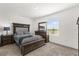 Comfortable bedroom features carpet, natural light, a bed with upholstered headboard, and dark wood furniture at 2224 Tay Wes Dr, St Cloud, FL 34771
