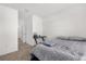 This bedroom with carpet includes a bed, desk, and doorways into the hallway and closet at 2224 Tay Wes Dr, St Cloud, FL 34771
