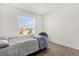 A well-lit bedroom with a bed and window, offering a view of the neighborhood at 2224 Tay Wes Dr, St Cloud, FL 34771