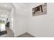 Bright hallway featuring tile flooring, white walls, and stylish decor at 2224 Tay Wes Dr, St Cloud, FL 34771
