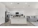Modern kitchen with white cabinetry, stainless steel appliances, and island with seating at 2224 Tay Wes Dr, St Cloud, FL 34771