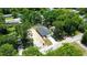 An aerial of the property showing the home, driveway, and surrounding trees at 2260 Suanne Ave, Eustis, FL 32726
