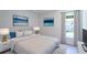 Serene bedroom with natural light, complemented by stylish furnishings and artwork at 2260 Suanne Ave, Eustis, FL 32726