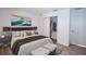 Comfortable bedroom featuring neutral tones, closet, and soft luxury vinyl flooring at 2260 Suanne Ave, Eustis, FL 32726