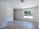 Bright bedroom with natural light, modern finishes, and luxury vinyl flooring at 2260 Suanne Ave, Eustis, FL 32726