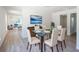 Formal dining room with stylish glass table and views into the adjacent living room at 2260 Suanne Ave, Eustis, FL 32726