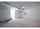 Spacious garage with concrete flooring, overhead lighting, and ample storage space at 2260 Suanne Ave, Eustis, FL 32726