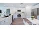 Bright kitchen features stainless steel appliances, ample counter space, and white cabinets at 2260 Suanne Ave, Eustis, FL 32726
