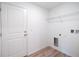 Efficient laundry room featuring new flooring, a wire shelf and utility hookups at 2260 Suanne Ave, Eustis, FL 32726