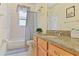 Cozy bathroom featuring a tub and shower, a vanity with storage, and a large mirror at 236 Boxwood Dr, Davenport, FL 33837