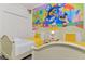 Charming bedroom featuring two twin beds and a colorful Disney themed mural wall at 236 Boxwood Dr, Davenport, FL 33837