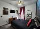 Themed bedroom features decor, dark wood accents, and a full-size bed at 236 Boxwood Dr, Davenport, FL 33837