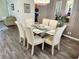 Stately dining area with seating for six and modern fixtures at 236 Boxwood Dr, Davenport, FL 33837