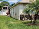 Exterior view showing the lush lawn and the side of this well maintained home at 236 Boxwood Dr, Davenport, FL 33837
