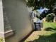 Home exterior with a modern air conditioning unit and yard waste bin at 236 Boxwood Dr, Davenport, FL 33837