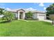 Charming single-story home with well-manicured lawn and lovely landscaping at 236 Boxwood Dr, Davenport, FL 33837