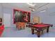 Spacious game room features a pool table, foosball table, and Star Wars themed mural at 236 Boxwood Dr, Davenport, FL 33837