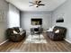 Comfortable living room featuring hardwood floors and stylish decor at 236 Boxwood Dr, Davenport, FL 33837
